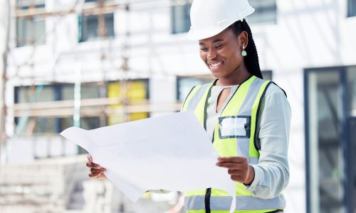 architect-black-woman-and-blueprint-for-building-at-a-construction-site-happy-and-positive-mindse